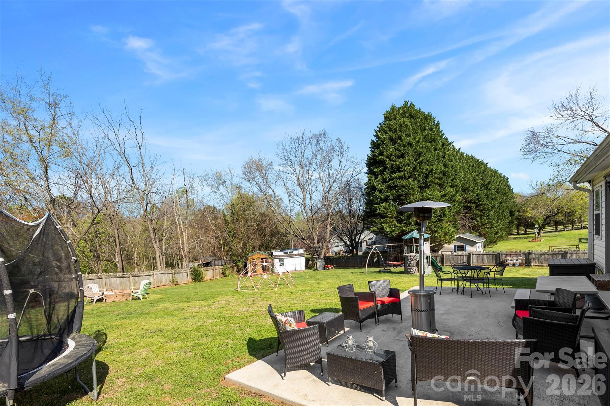 123 Chestnut Ridge Road Kings Mountain, NC 28086 - Photo 34 of 36 a view of a patio with couches table and chairs and potted plants