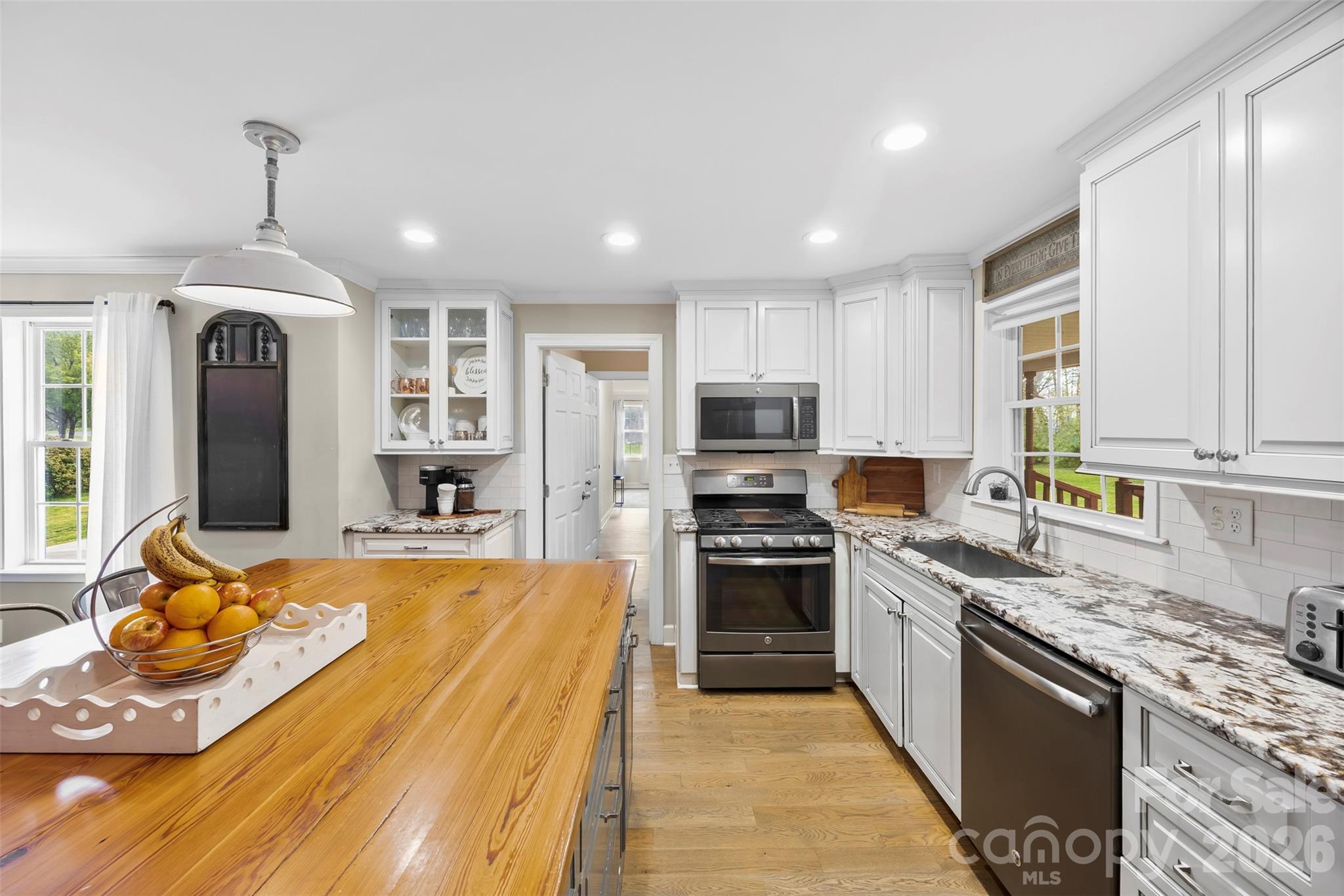 123 Chestnut Ridge Road Kings Mountain, NC 28086 - Photo 4 of 36 a large kitchen with stainless steel appliances granite countertop a stove refrigerator and cabinets