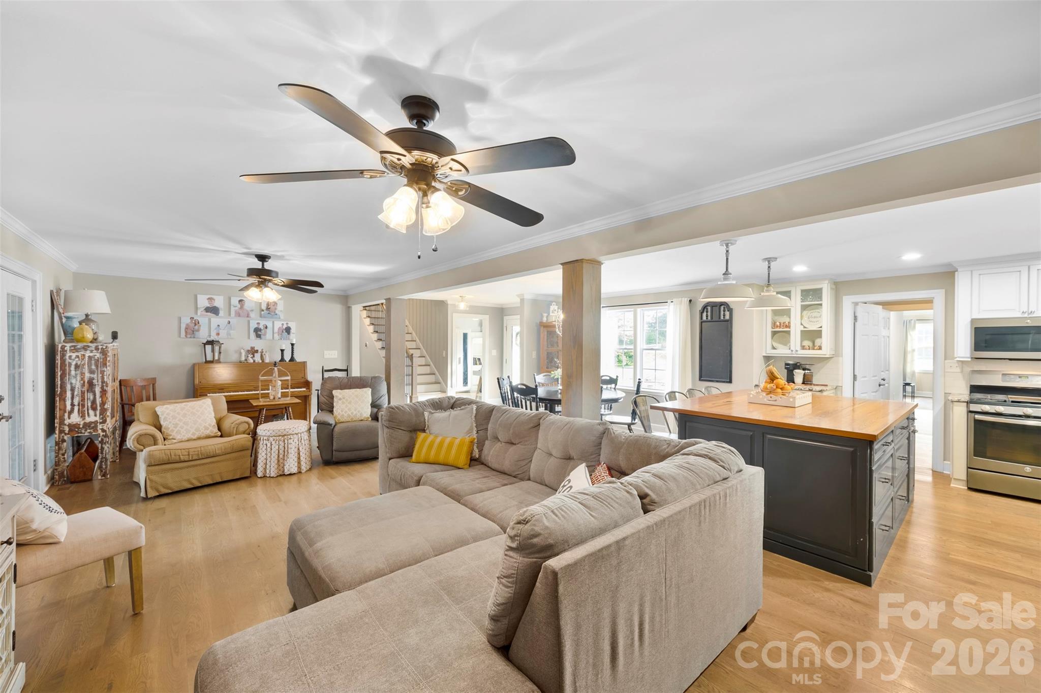 123 Chestnut Ridge Road Kings Mountain, NC 28086 - Photo 7 of 36 a living room with furniture and a chandelier