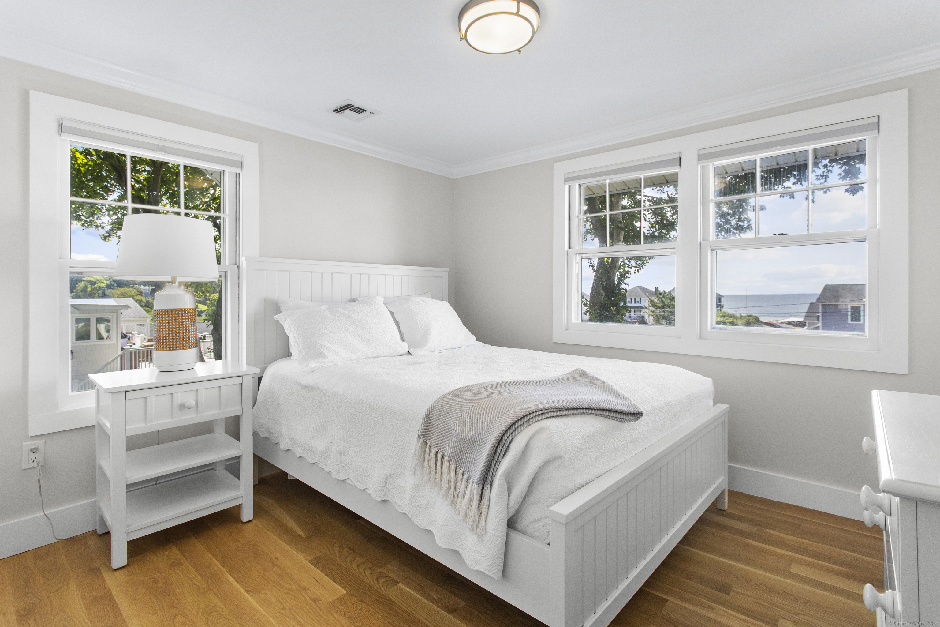 15 Cottage Road Old Lyme, CT 06371 - Photo 16 of 26 a bedroom with a bed and a window