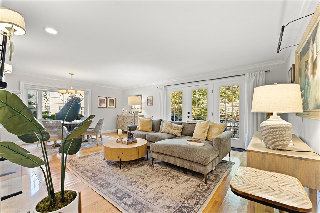 16 Preacher Road, Unit 16 Milton, MA 02186 - Photo 11 of 32 a living room with furniture and wooden floor