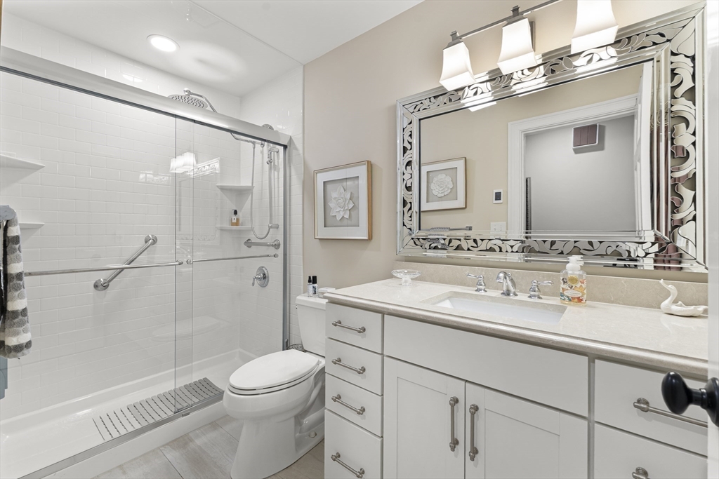 16 Preacher Road, Unit 16 Milton, MA 02186 - Photo 21 of 32 a bathroom with a sink a toilet and shower