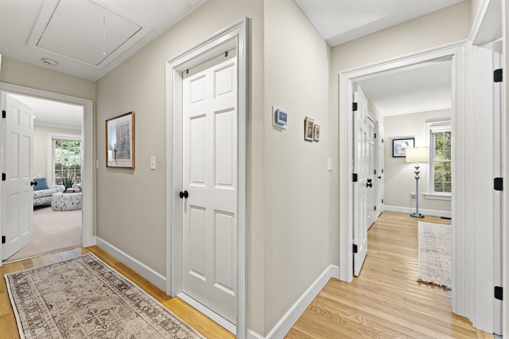 16 Preacher Road, Unit 16 Milton, MA 02186 - Photo 23 of 32 a view of a hallway with a livingroom and hardwood floor