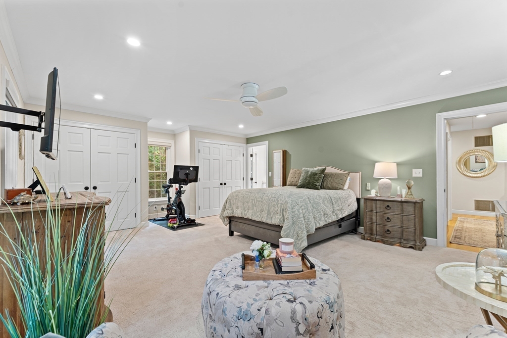 16 Preacher Road, Unit 16 Milton, MA 02186 - Photo 25 of 32 a living room with furniture a large window and kitchen view