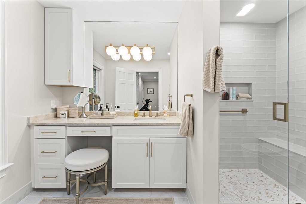 16 Preacher Road, Unit 16 Milton, MA 02186 - Photo 27 of 32 a bathroom with a sink a mirror and a shower