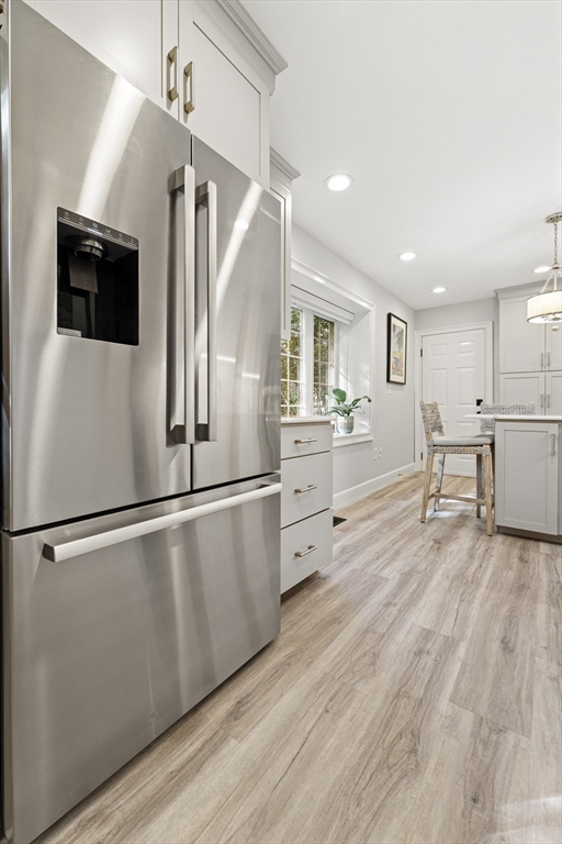 16 Preacher Road, Unit 16 Milton, MA 02186 - Photo 8 of 32 a kitchen with stainless steel appliances a refrigerator and a stove top oven