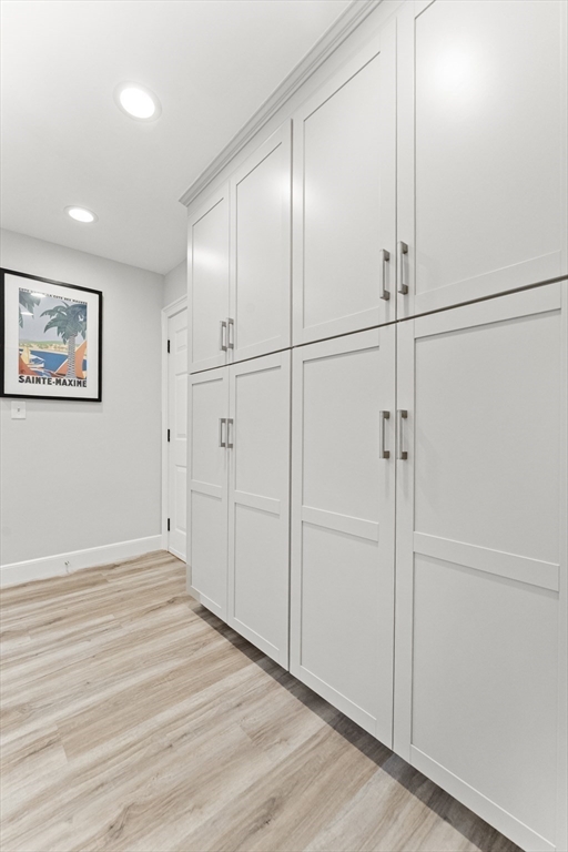 16 Preacher Road, Unit 16 Milton, MA 02186 - Photo 10 of 32 an empty room with wooden floor