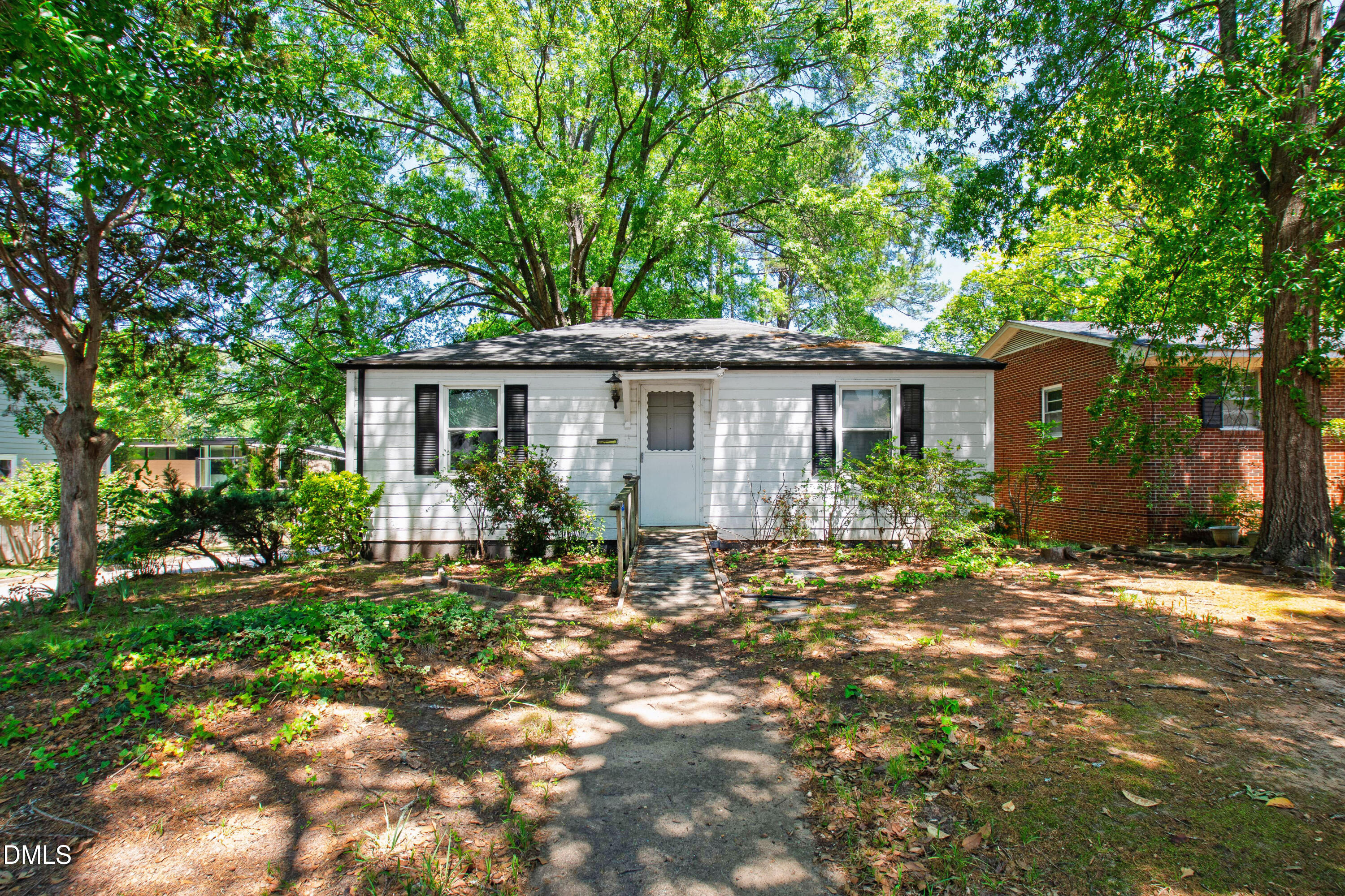 2316 Bedford Avenue Raleigh, NC 27607 - Photo 1 of 30 a front view of a house with a garden