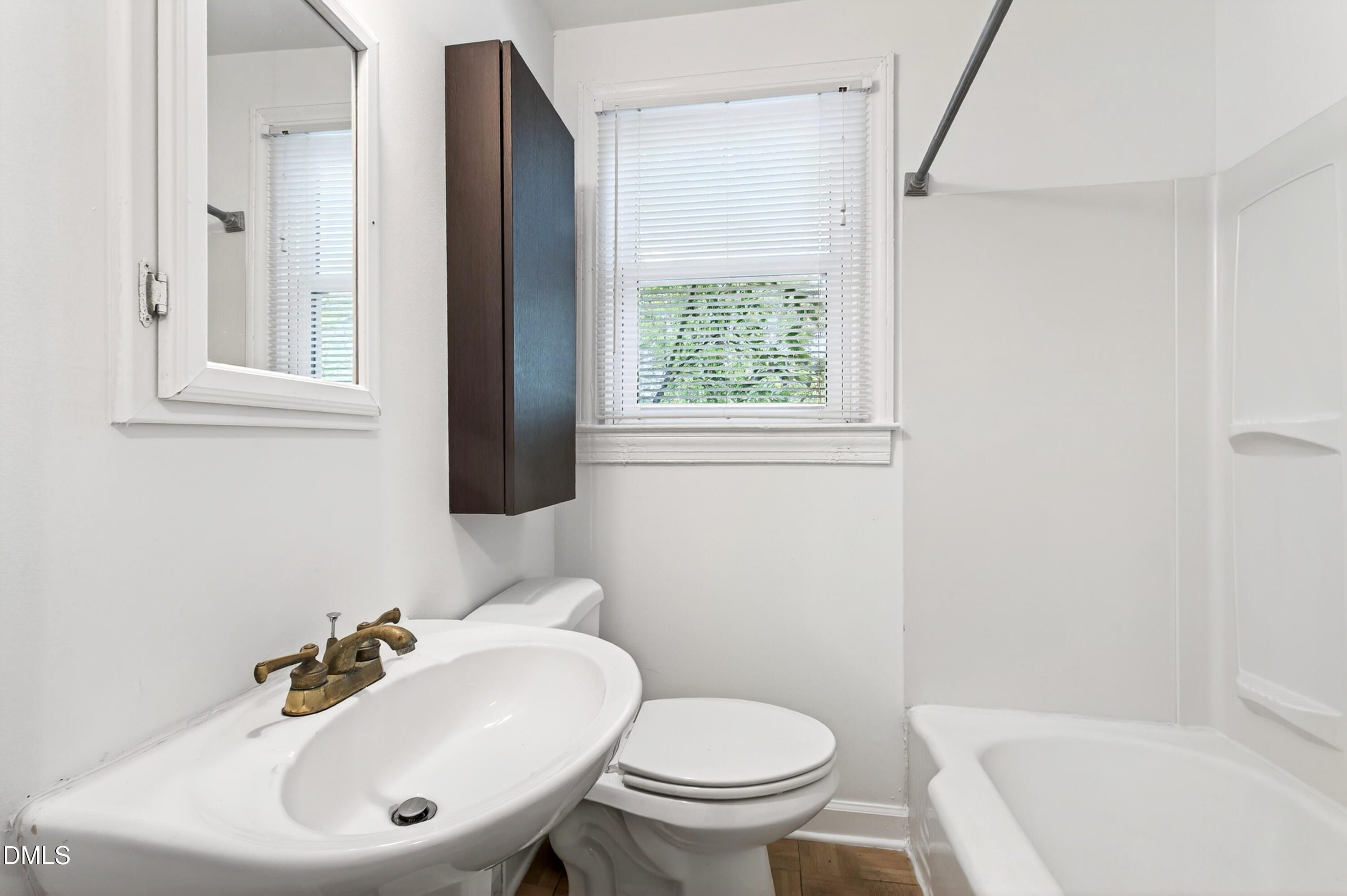 2316 Bedford Avenue Raleigh, NC 27607 - Photo 16 of 30 a bathroom with a sink toilet and a mirror