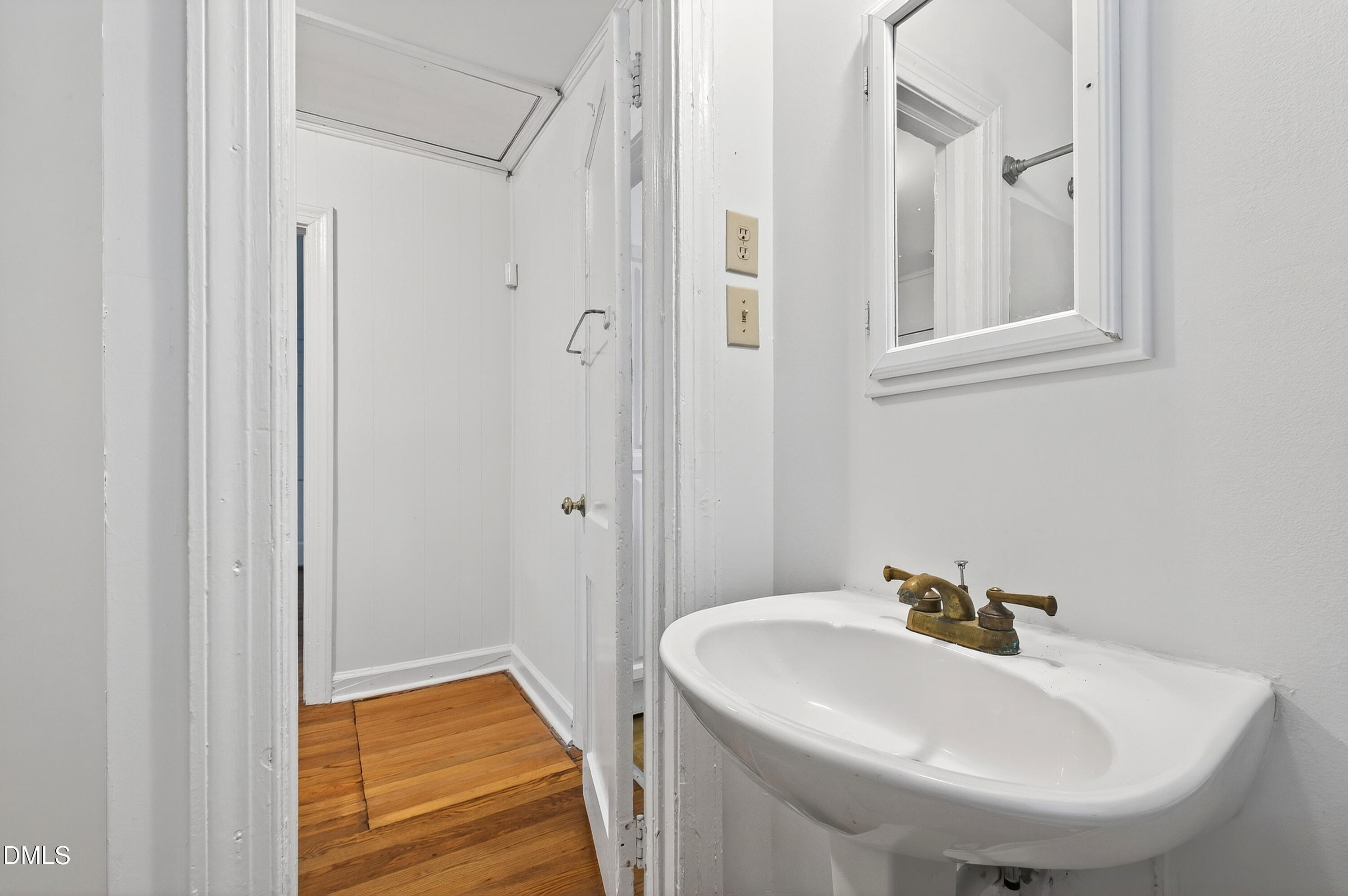 2316 Bedford Avenue Raleigh, NC 27607 - Photo 18 of 30 a bathroom with a sink and a mirror