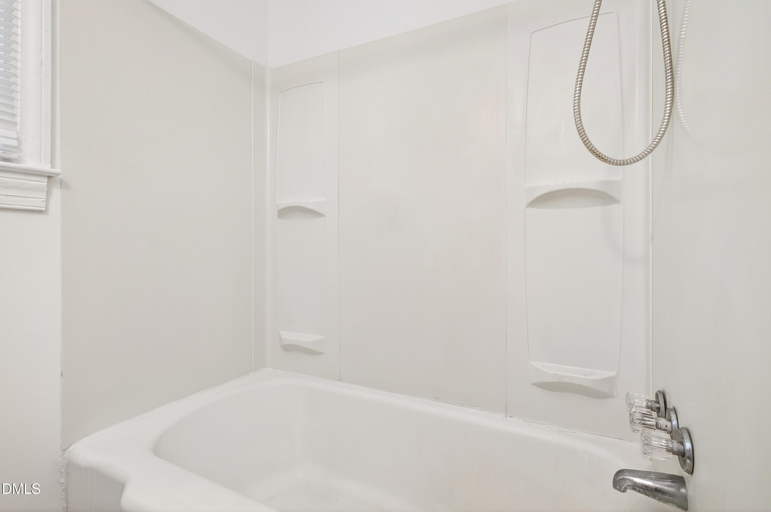 2316 Bedford Avenue Raleigh, NC 27607 - Photo 19 of 30 a bathroom with a white bath tub and a shower