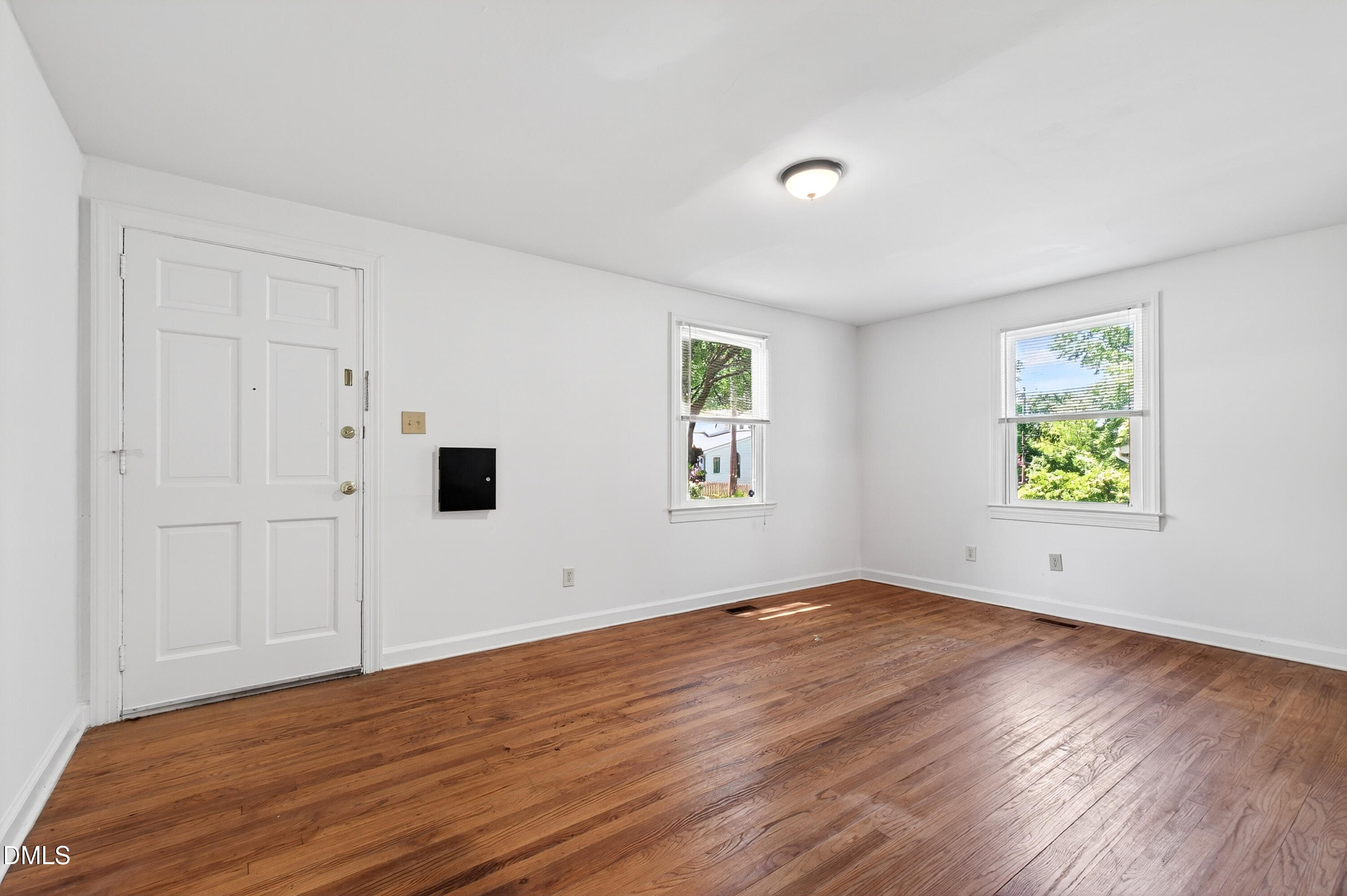 2316 Bedford Avenue Raleigh, NC 27607 - Photo 21 of 30 an empty room with window and wooden floor