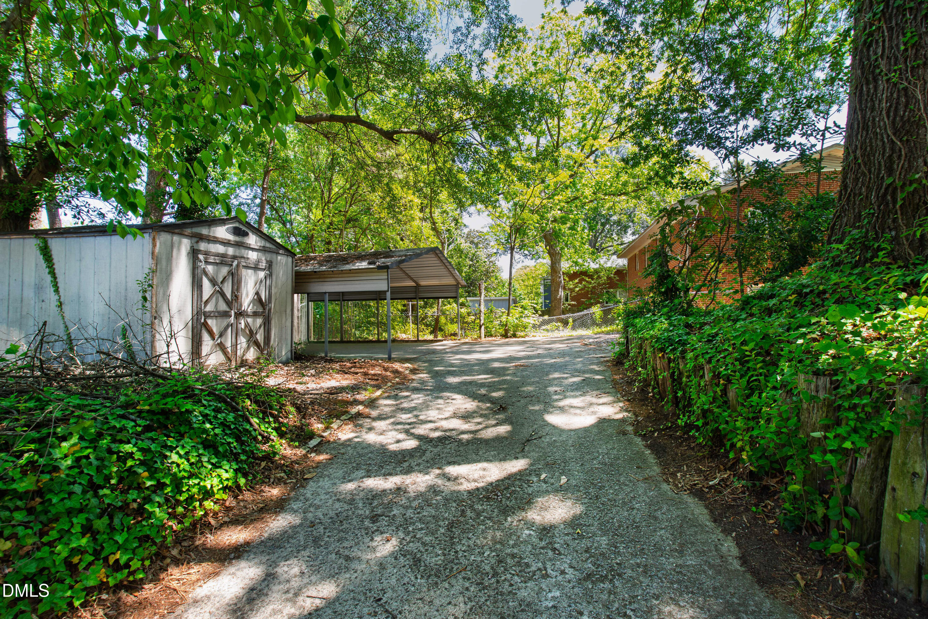 2316 Bedford Avenue Raleigh, NC 27607 - Photo 26 of 30 a view of a yard with plants and large trees