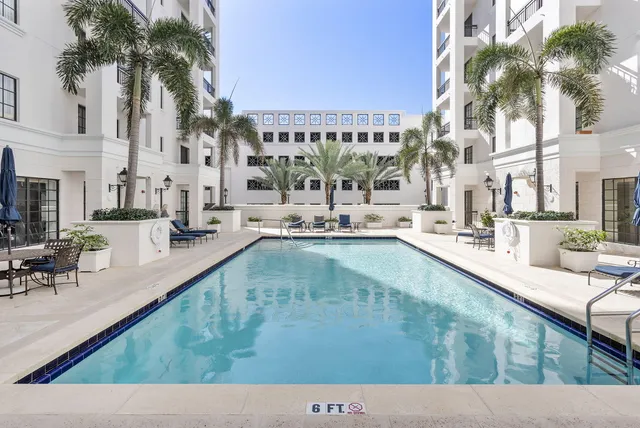 a view of swimming pool with outdoor seating