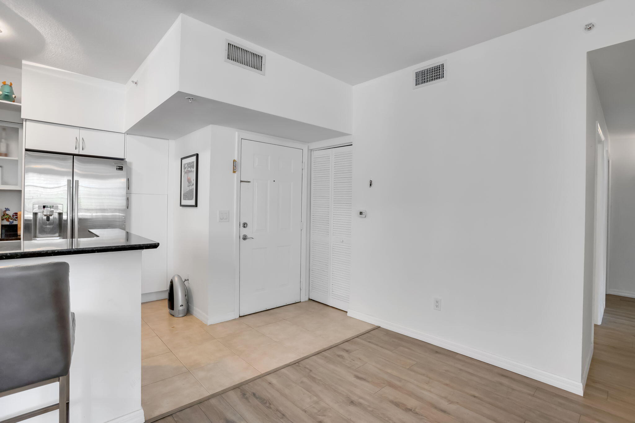 233 South Federal Highway, Unit 325 Boca Raton, FL 33432 - Photo 6 of 30 a view of a kitchen from the hallway