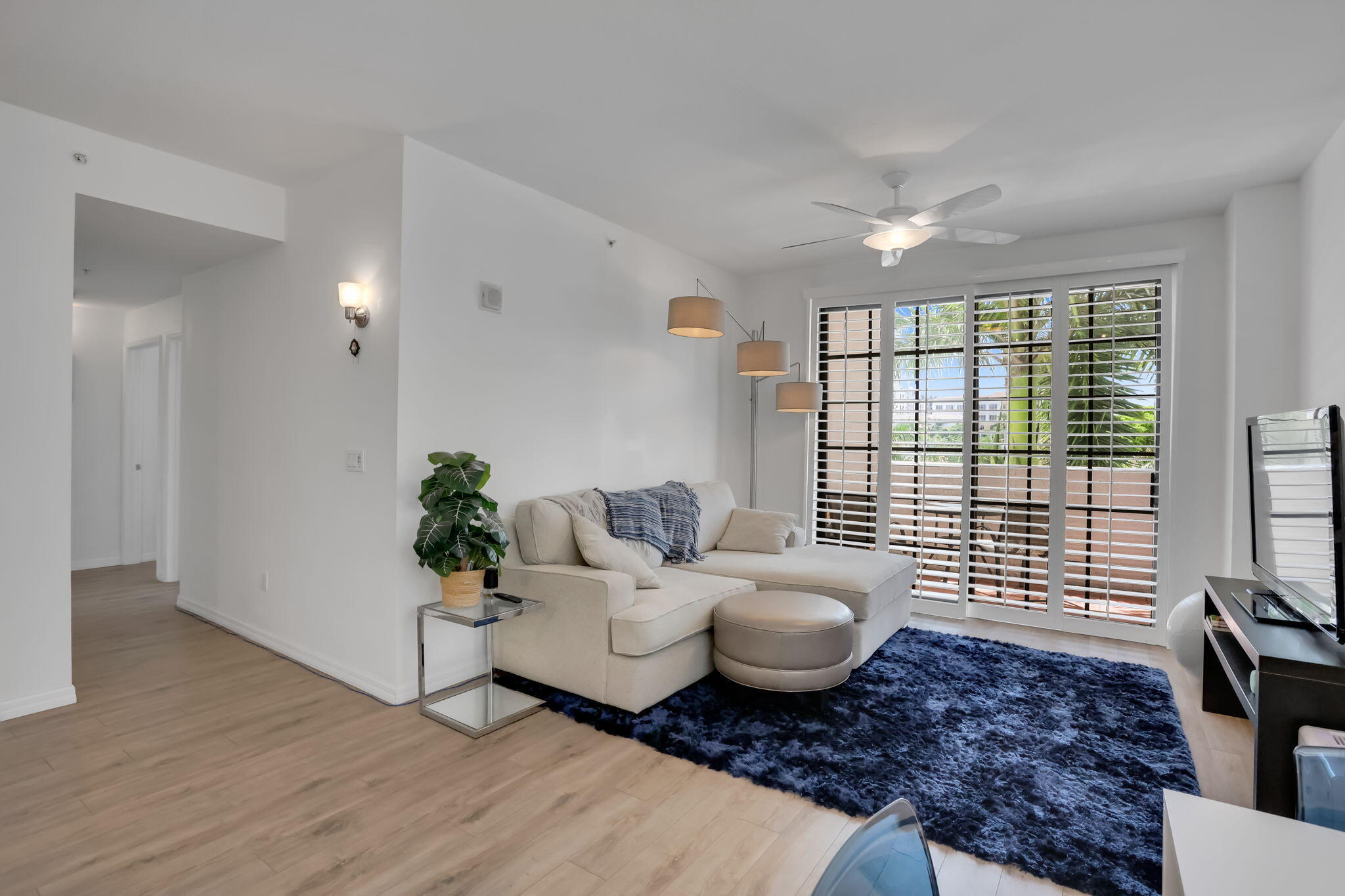 233 South Federal Highway, Unit 325 Boca Raton, FL 33432 - Photo 8 of 30 a living room with furniture and wooden floor