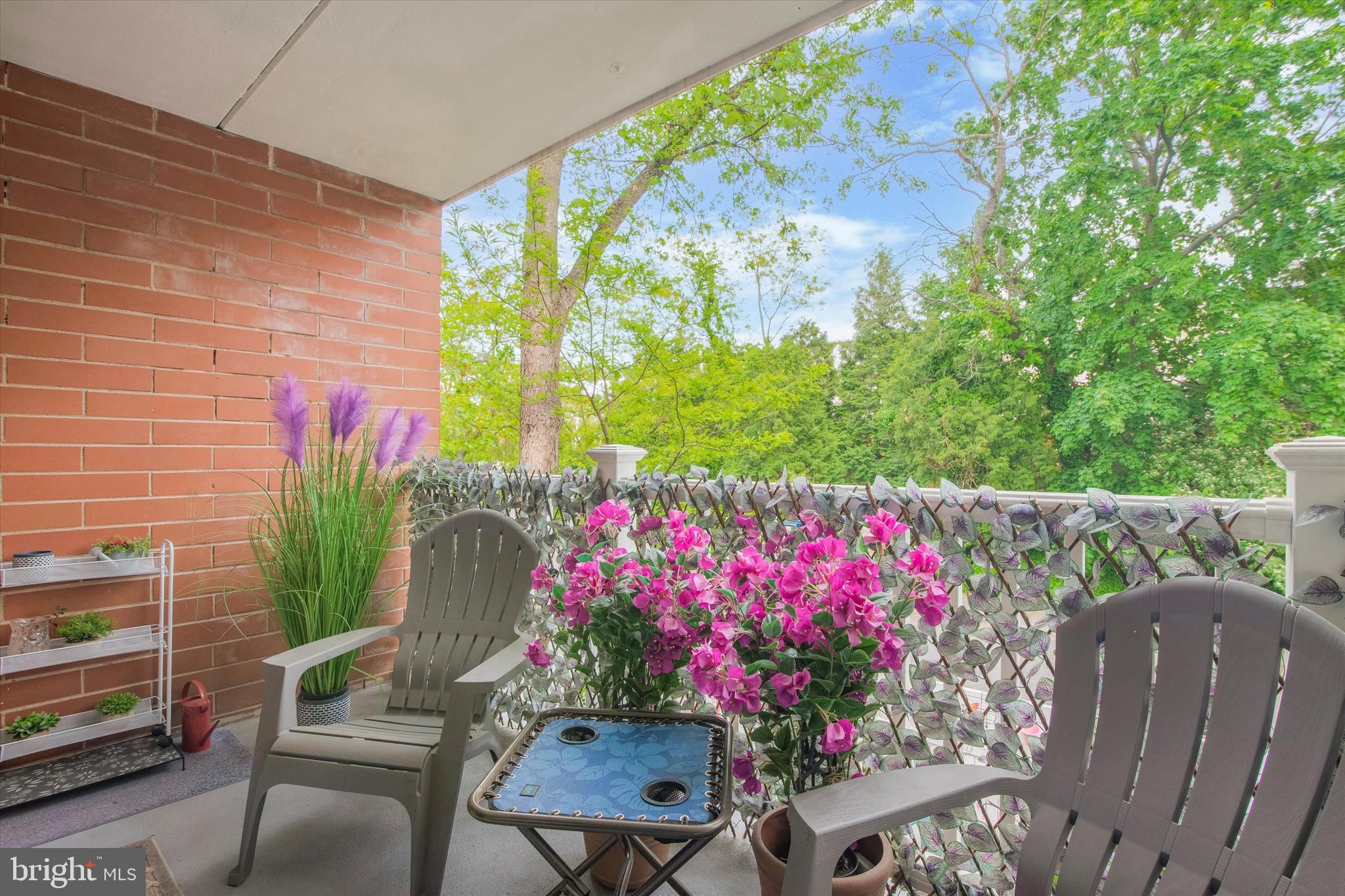 46 Township Line Road, Unit 209 Elkins Park, PA 19027 - Photo 6 of 15 a front view of a house with a yard and a fountain