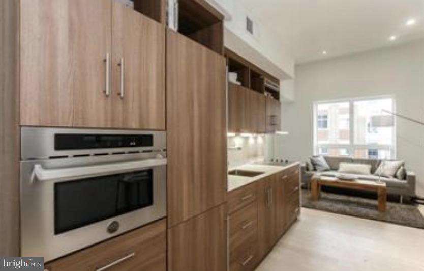 2422-2424 17th Street Northwest, Unit 201 Washington, DC 20009 - Photo 2 of 7 a kitchen with a stove and a sink