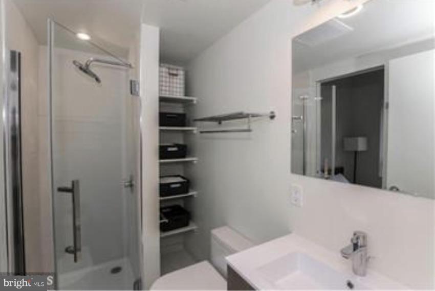 2422-2424 17th Street Northwest, Unit 201 Washington, DC 20009 - Photo 7 of 7 a bathroom with a sink toilet and shower
