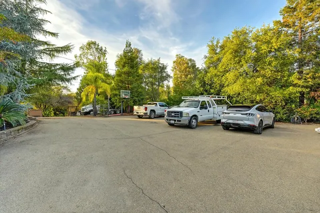 a large bathroom with a sink a mirror and a bathtub