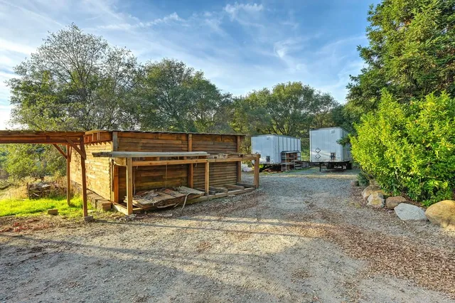 a kitchen with granite countertop white cabinets and a stove