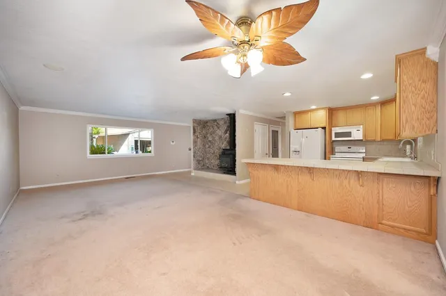 a view of a patio with a table under an umbrella