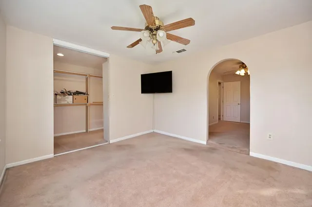 a view of a big yard with a trees