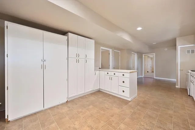 a aerial view of a house with swimming pool and garden