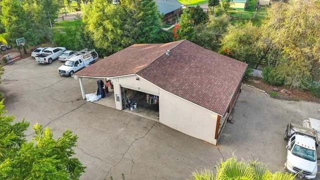 a backyard of a house with table and chairs
