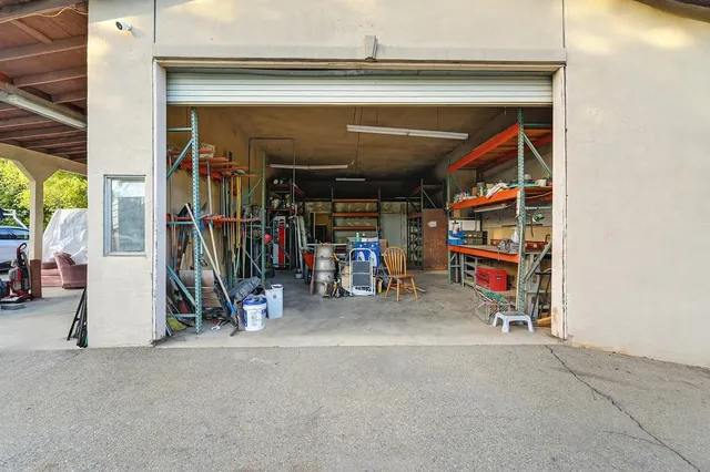 a view of a house with a yard and garage