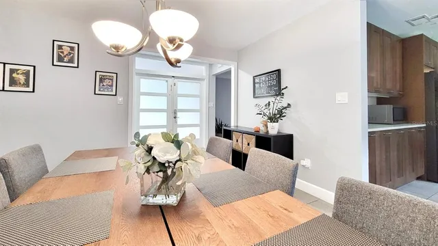 a living room with furniture chandelier and a chandelier