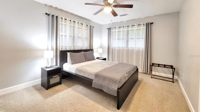 a bedroom with a bed and window