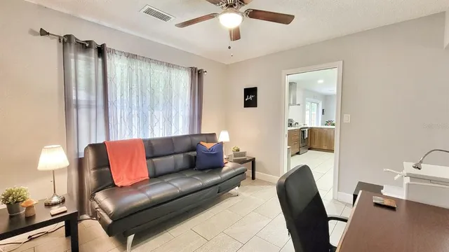 a living room with furniture and a window