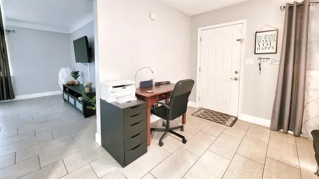 a view of a workspace with furniture