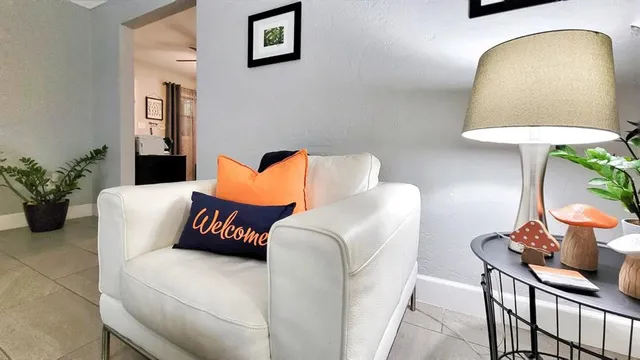 a bedroom with a bed and a potted plant