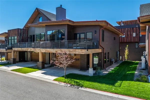 a front view of a house with yard