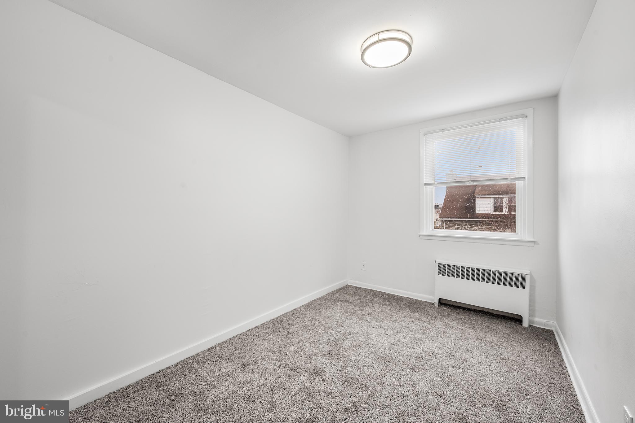 920 Durard Street Philadelphia, PA 19150 - Photo 12 of 16 an empty room with cabinet and mirror