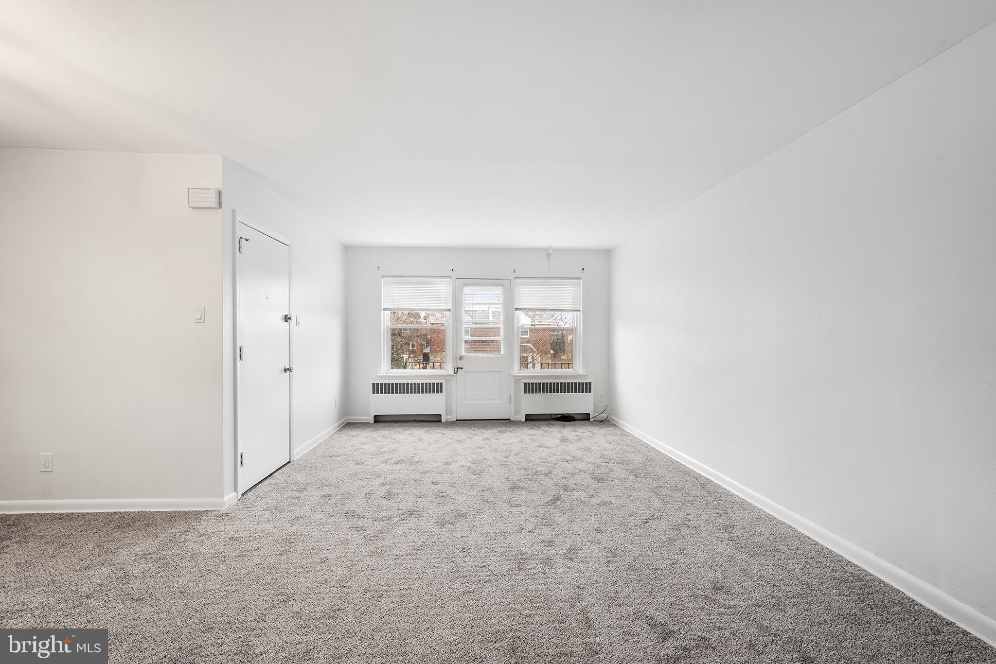 920 Durard Street Philadelphia, PA 19150 - Photo 4 of 16 an empty room with windows