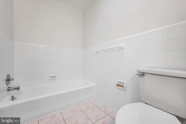 an empty room with a empty space and windows