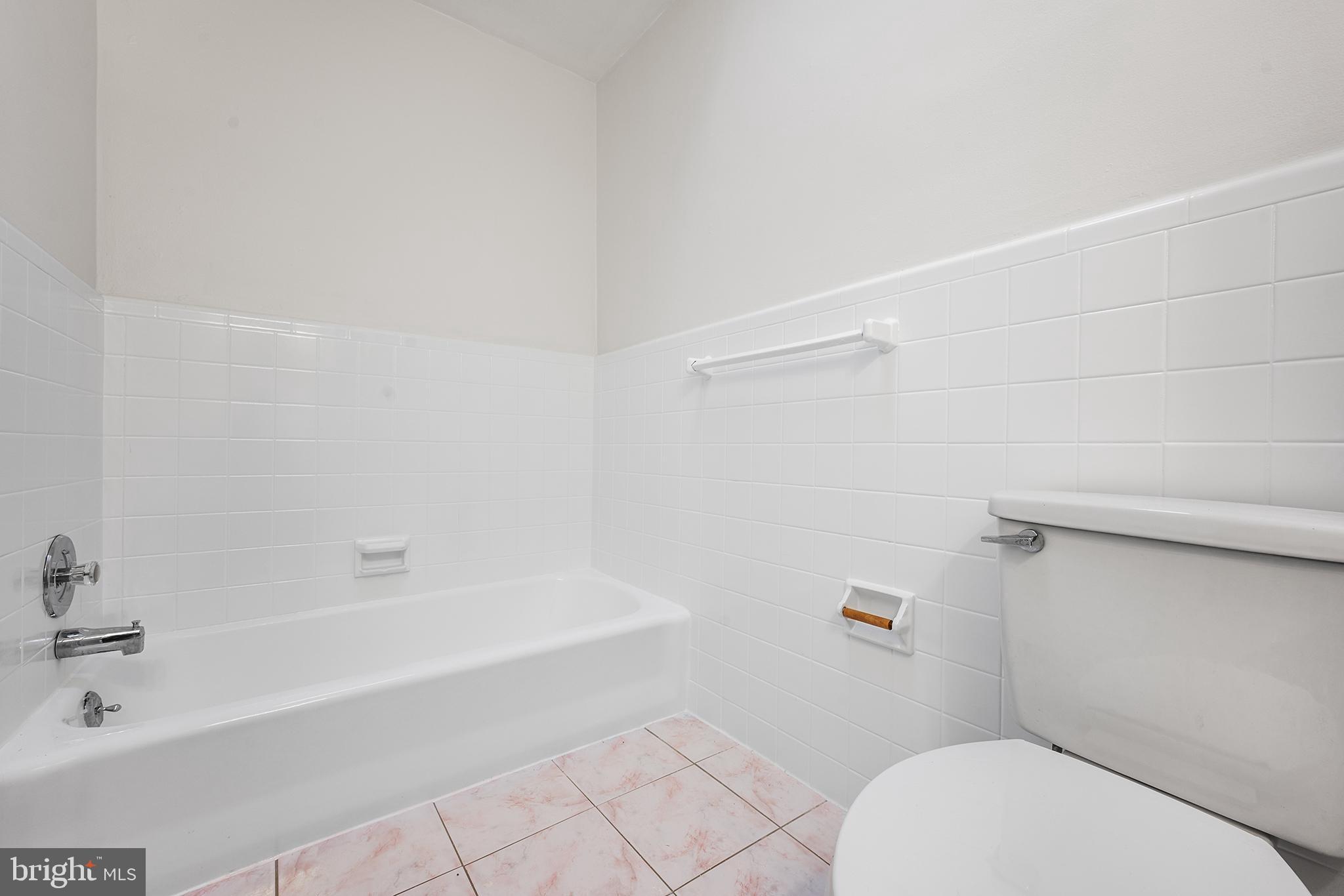 920 Durard Street Philadelphia, PA 19150 - Photo 9 of 16 a bathroom with a bathtub and a toilet