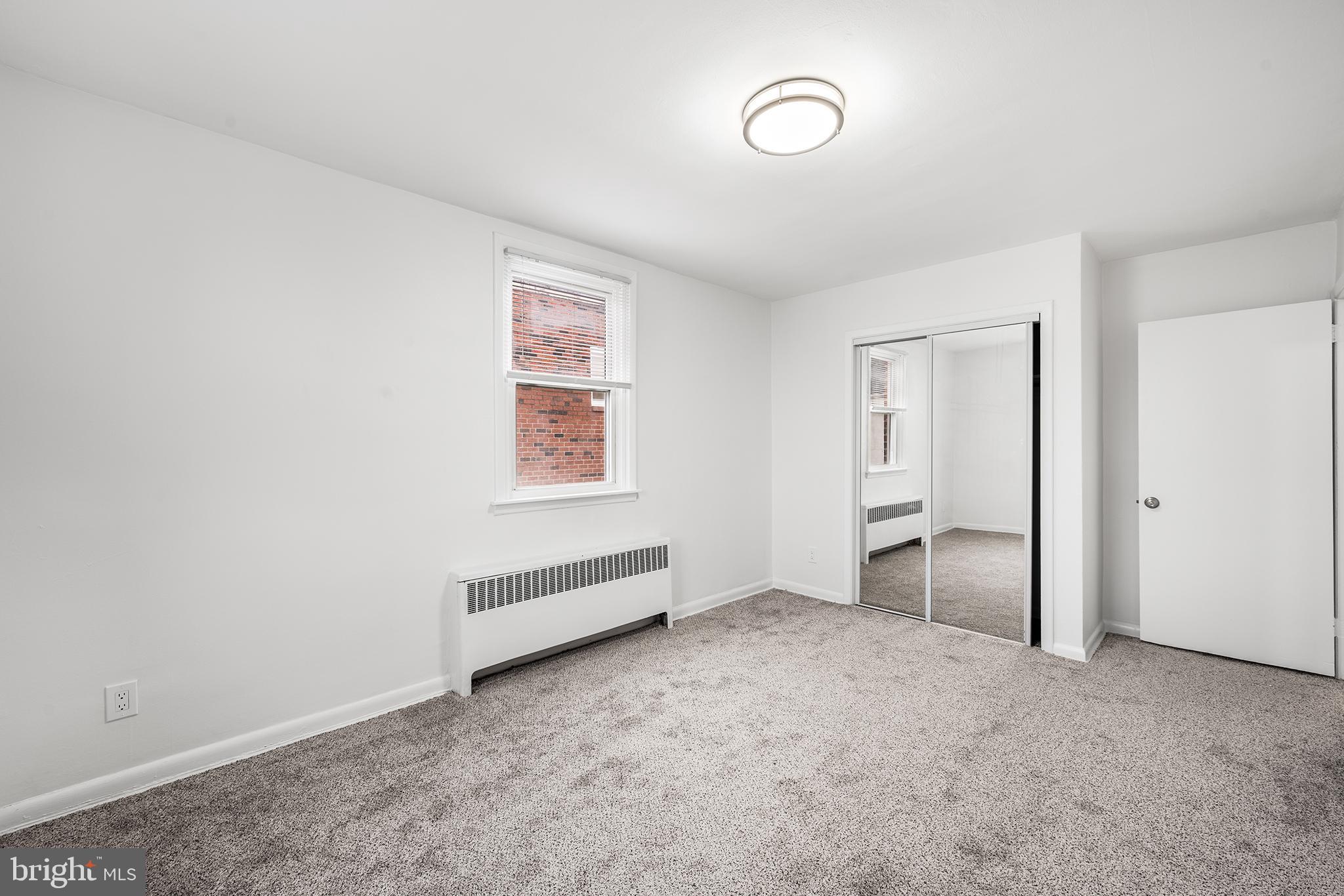 920 Durard Street Philadelphia, PA 19150 - Photo 10 of 16 an empty room with a empty space and windows