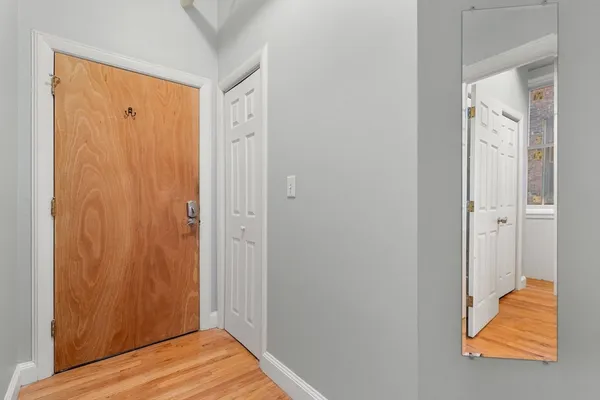a view of a bathroom with wooden floor