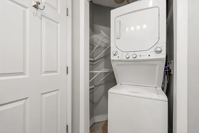 a bathroom with a toilet and a mirror