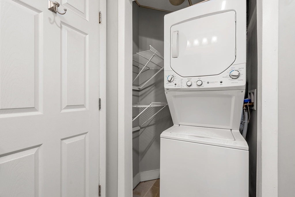 62 Washington Street, Unit 5 Haverhill, MA 01832 - Photo 22 of 34 a bathroom with a toilet and a mirror