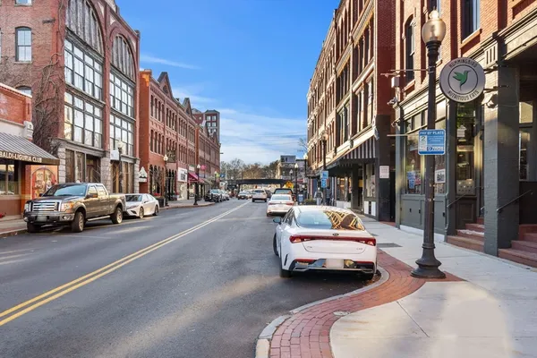a car parked in front of a buildings