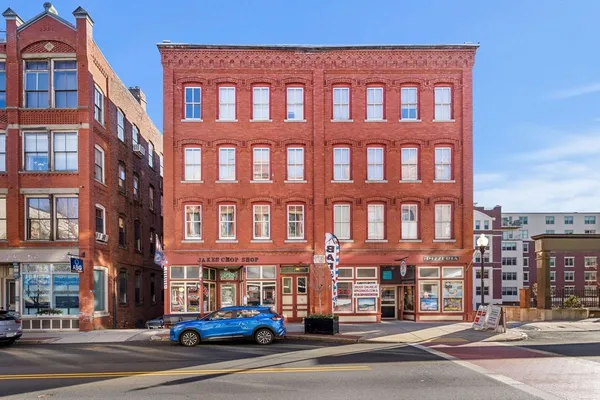 a tall building sitting on the side of a street