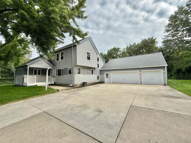 a front view of a house with yard
