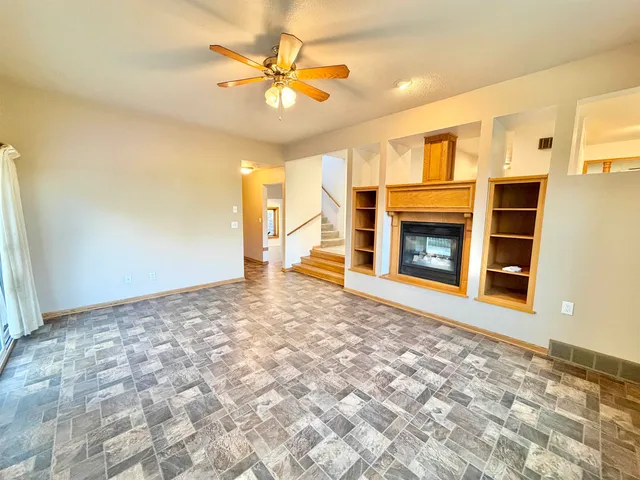 a bedroom with a bed and a potted plant