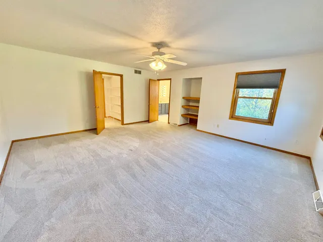 a bathroom with a tub a window and tub