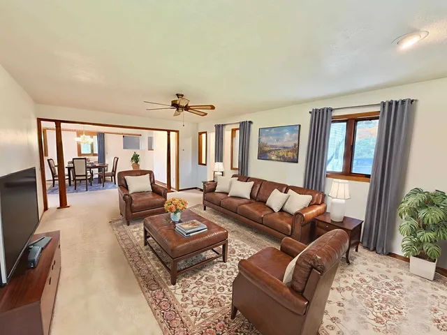 a living room with furniture and a table